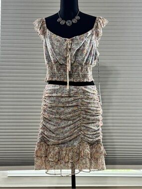 Floral two-piece crop top and ruched mini skirt set